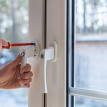 mounting a window handle with lock on the window